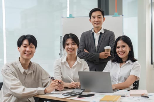 succesful business team smiling with teamwork corporate office colleague.