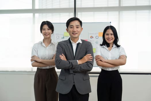 succesful business team smiling with teamwork corporate office colleague.