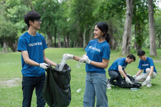 Volunteers collect litter, teenager smiling, environmental and ecological care.