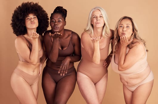 Women, body and different shape group blowing a kiss in studio for lingerie, beauty and diversity wearing underwear. Portrait of female friends together for body positivity, inclusion and self love.