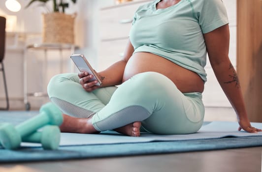 Yoga, pregnant black woman and hands with phone for social media and texting on workout break. Pregnancy, zen pilates and female with mobile smartphone for web browsing or scrolling after training