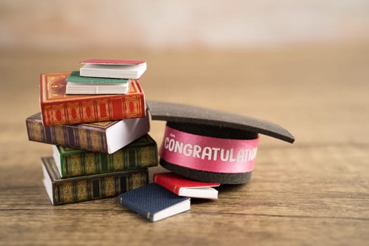 Graduation hat on book with copy space, learning university education concept.