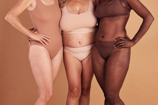 Diversity, closeup or women with body positivity, wellness or support on brown studio background. Multiracial, females or ladies with solidarity, skincare or confident for natural beauty or community.