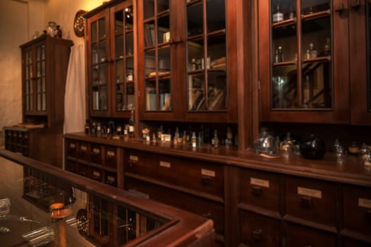 Vintage medications in old pharmacy, history concept background. Retro style.