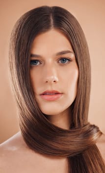 Portrait, hair care or woman with cosmetics, texture or natural beauty on brown studio background. Female, straight hair or organic growth for hairstyle, keratin or hair dye advertising for marketing.