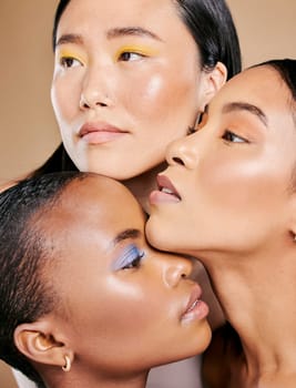 Beauty, diversity and face of women with makeup for creativity isolated on studio background. Skincare, cosmetology and model friends with facial cosmetics foundation in different shades on backdrop.