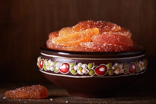 Candied dried apple slices in a ceramic bowl
