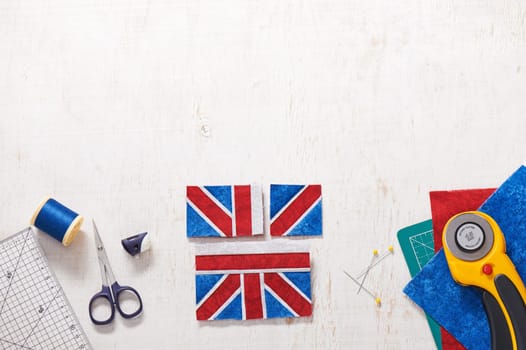 Parts of future pincushion viewing like union jack flag, sewing accessories