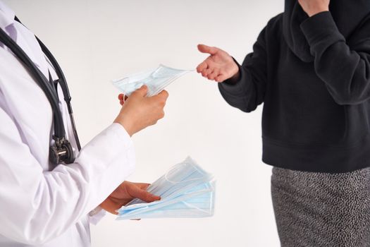 Doctor or nurse recommend to use protective face mask to protect from virus infection