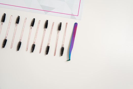 eyelash brushes on a white background with copyspace