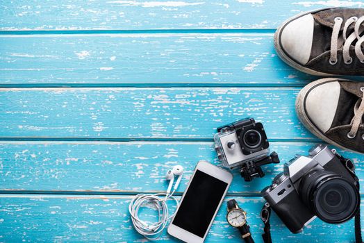 Top view of Traveler's accessories, Flat lay photography of Travel concept on blue background