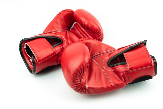 Red leather boxing gloves isolated on white background