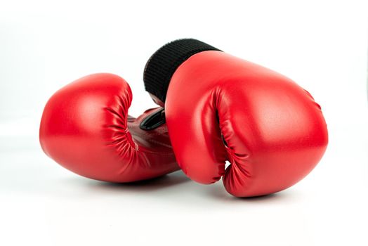 Red leather boxing gloves isolated on white background