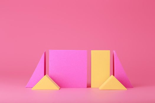 Abstract trendy futuristic background in pink and yellow colors with copy space. Bright pink artsy background with yellow elements against background with copy space