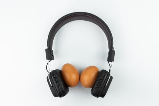 flat lay, headphone and eggs isolated on white background