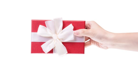 Asian woman holding, giving, sending a wrapped packaged gift box with tied bow-knot isolated on white background, clipping path, cut out, close up.