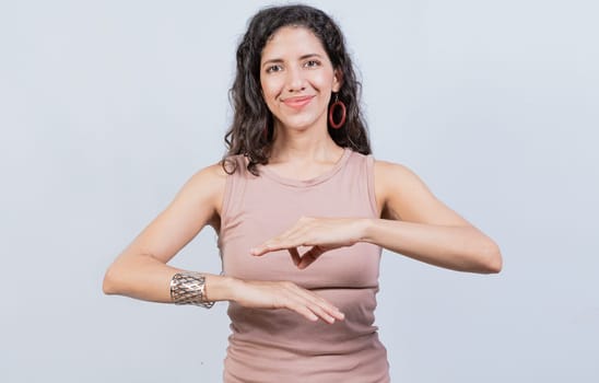 Smiling young woman gesturing in sign language. Female interpreter gesturing in sign language, People gesturing in sign language isolated