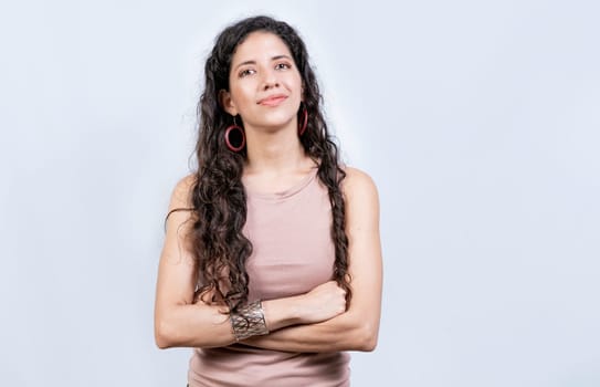 Portrait friendly latin girl in white background. Beautiful latin woman with arms crossed isolated. Nicaraguan woman on isolated background