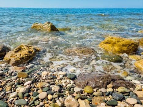 Stones on beach and sea water