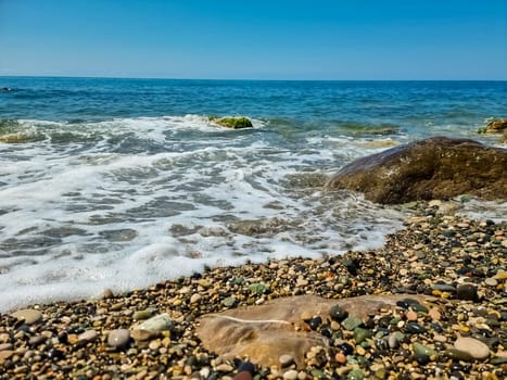 Stones on beach and sea water