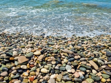 Stones on beach and sea water