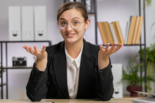 POV of Caucasian business woman working on laptop at office desk talk on online communication video call with employee, boss, teacher. Freelancer girl support services looking at camera. Webcam view