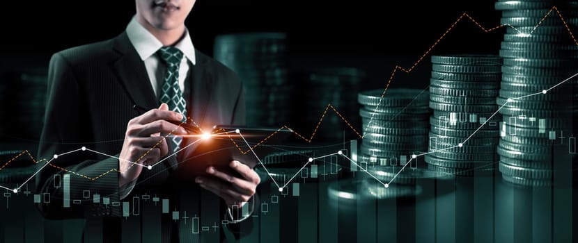 Businessman analyst working with digital finance business data graph showing technology of investment strategy for perceptive financial business decision. Digital economic analysis technology concept.