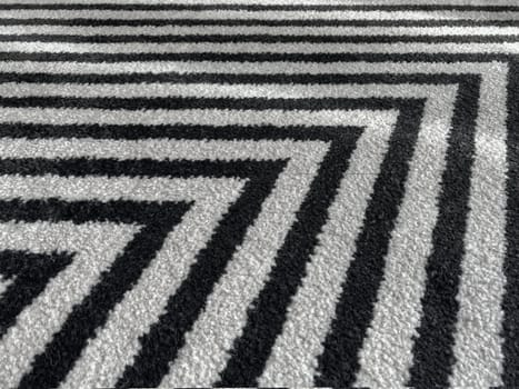 white rug or carpet stripe pattern with black stripes. texture background black and white nobody.abstract texture background.