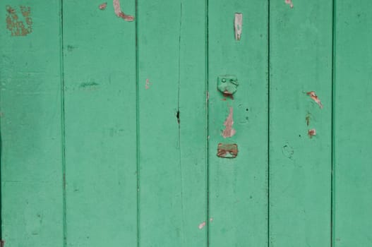 Dark bright lemonade lime green wooden old door with broken placeholder of handle