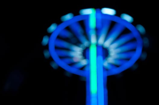 Abstract random colourful defocused blurred night life of fun fair background pattern