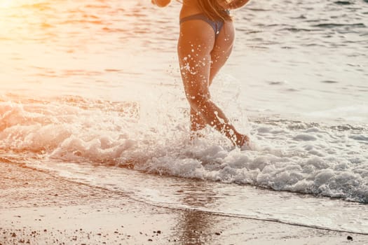Running woman. Female runner jogging during the sunrise on beach. Woman Runner feet running on the beach at sunrise. woman fitness sunrise jog workout wellness concept.