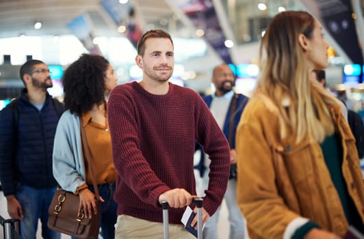 Travel, queue and smile with man in airport for vacation, international trip and tourism. Holiday, luggage and customs with passenger in line for ticket, departure and flight transportation.