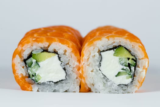 Sushi rolls philadelphia classic with fresh salmon and cream cheese. Japanese traditional food