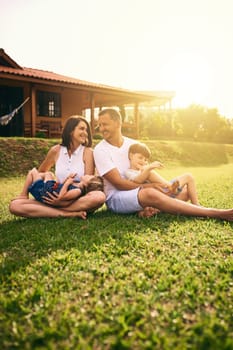 Shot of a happy family bonding together outdoors.