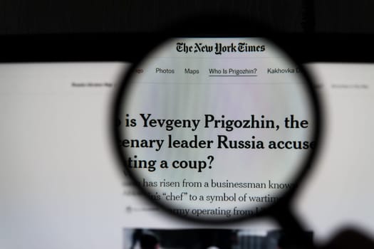 Kyiv, Ukraine - 24 June 2023: The New York Times page on a monitor screen through a magnifying glass with the article Who is Yevgeny Prigozhin, the mercenary leader Russia accused of mounting a coup