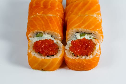 Japanese traditional food. Sushi rolls philadelphia classic with fresh salmon and cream cheese and caviar