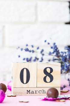 Date of March 8, International Women's Day with copy space. Wooden decorative calendar