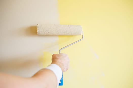 Professional wall painting, roller painting on interior walls. Renovation concept