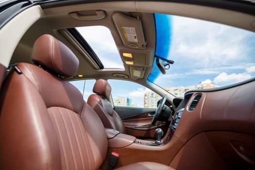 Brown leather seats in the new car. Interior upholstery with genuine leather.