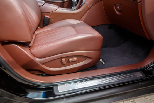 Brown leather seats in the new car. Interior upholstery with genuine leather.