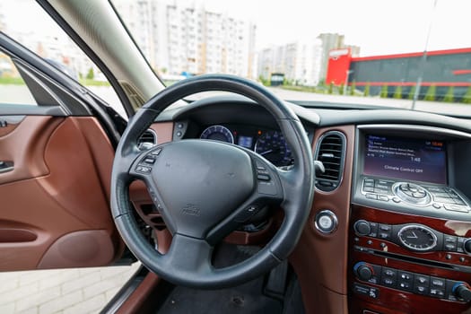 Modern SUV interior with leather panel, multimedia and dashboard