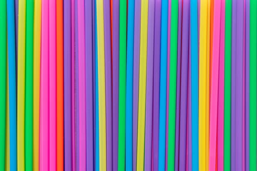 abstract background of bright multicolored cocktail tubes. Colorful tubes for background