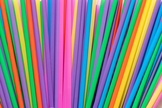 abstract background of bright multicolored cocktail tubes. Colorful tubes for background