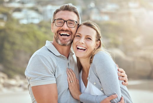 Happy, smile and portrait of couple at beach for love, travel and summer vacation. Happiness, holiday and romance with man and woman hugging on seaside date for bonding, affectionate and care.