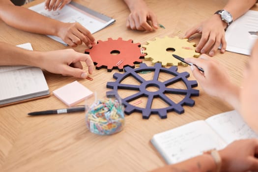 Team, strategy collaboration and gears innovation problem solving in business meeting. Corporate teamwork planning, research development analysis and abstract project partnership at office work table.