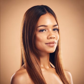 Beauty, hair and portrait of woman for wellness, keratin treatment and haircare aesthetic in studio. Salon, hairdresser and face of female person on brown background for growth, shine and texture.