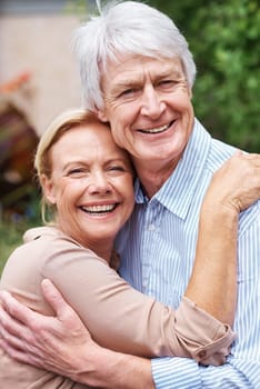 Together since forever. an elderly couple embracing each other outdoors