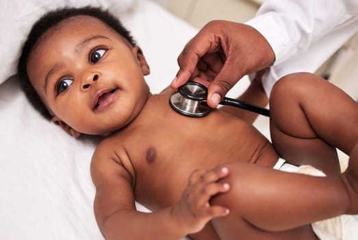 African, little baby and stethoscope in bed for health checkup or pediatrician with infant or healthcare clinic and medical wellness. Child patient, cardiology and expert with toddler in hospital.