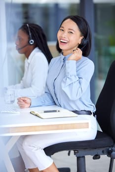 Call center, customer support and portrait of a telemarketing consultant working in modern office. Crm, customer service and happy sales woman from Singapore doing online consultation with technology.