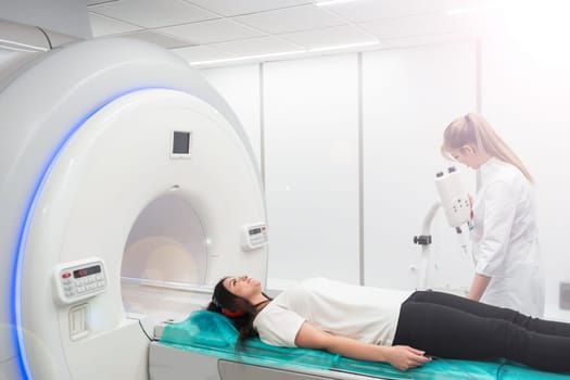 Medical CT or MRI Scan in the modern hospital laboratory. Interior of radiography department. Technologically advanced equipment in white room. Magnetic resonance diagnostics machine.